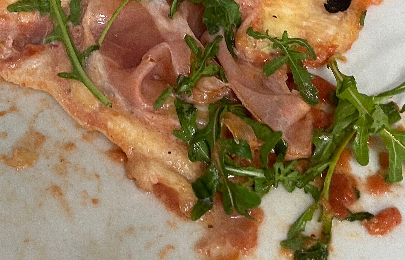 La Bottega pizza with cured meat and rocket